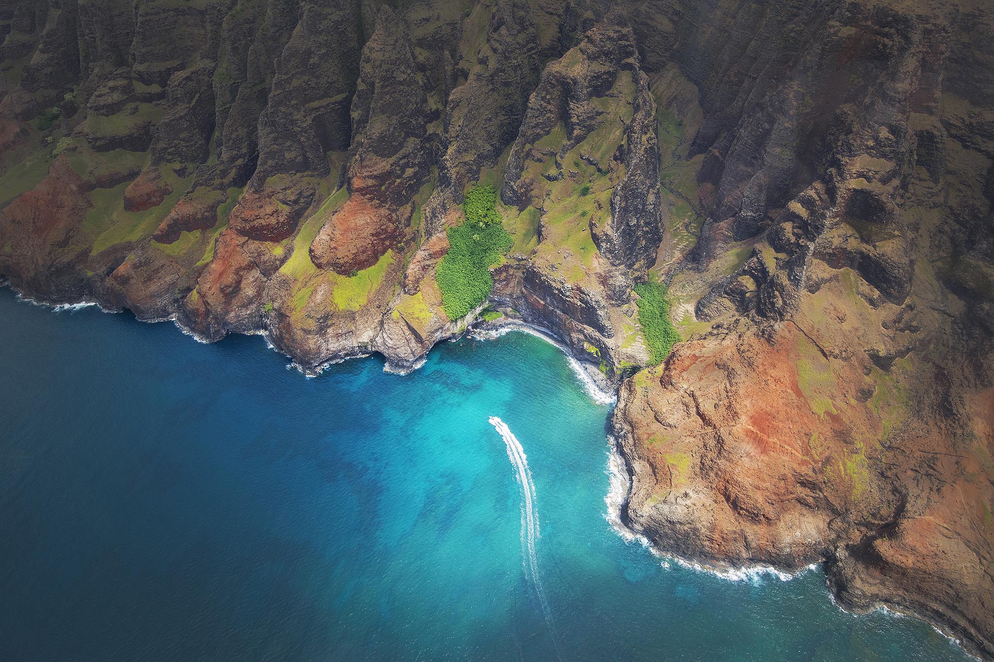 Aerial Picture of Boat along Kauai NePali Coast.