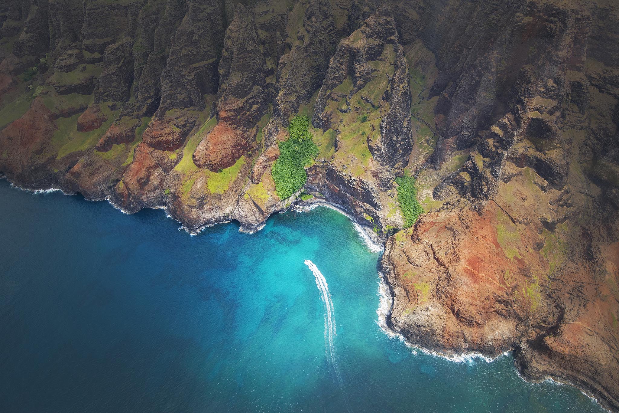 Aerial Picture of Boat along Kauai NePali Coast.