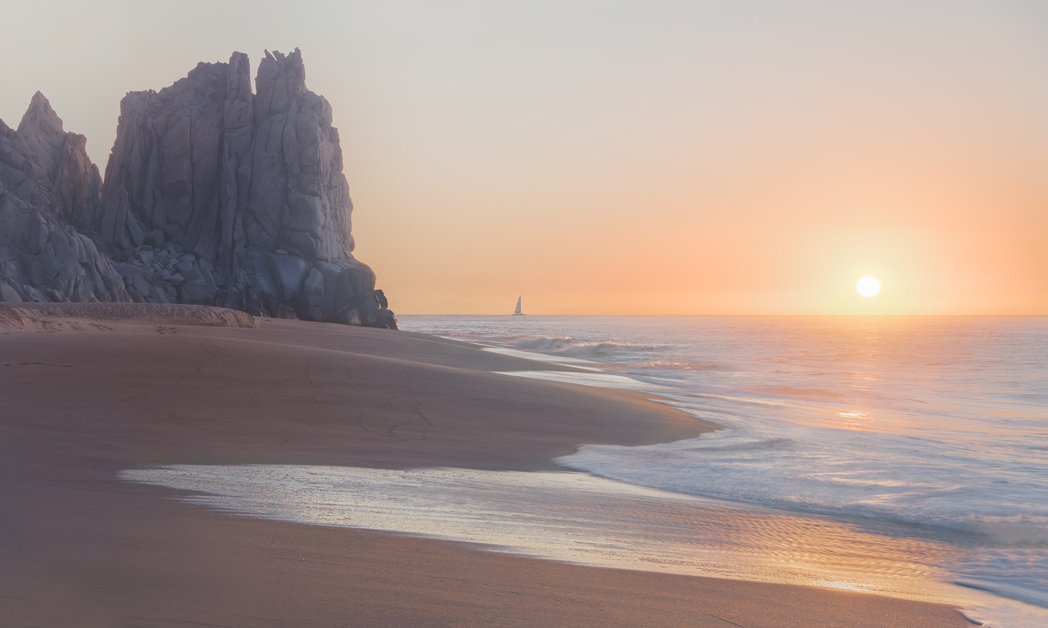 Sun and sailboat at sunrise