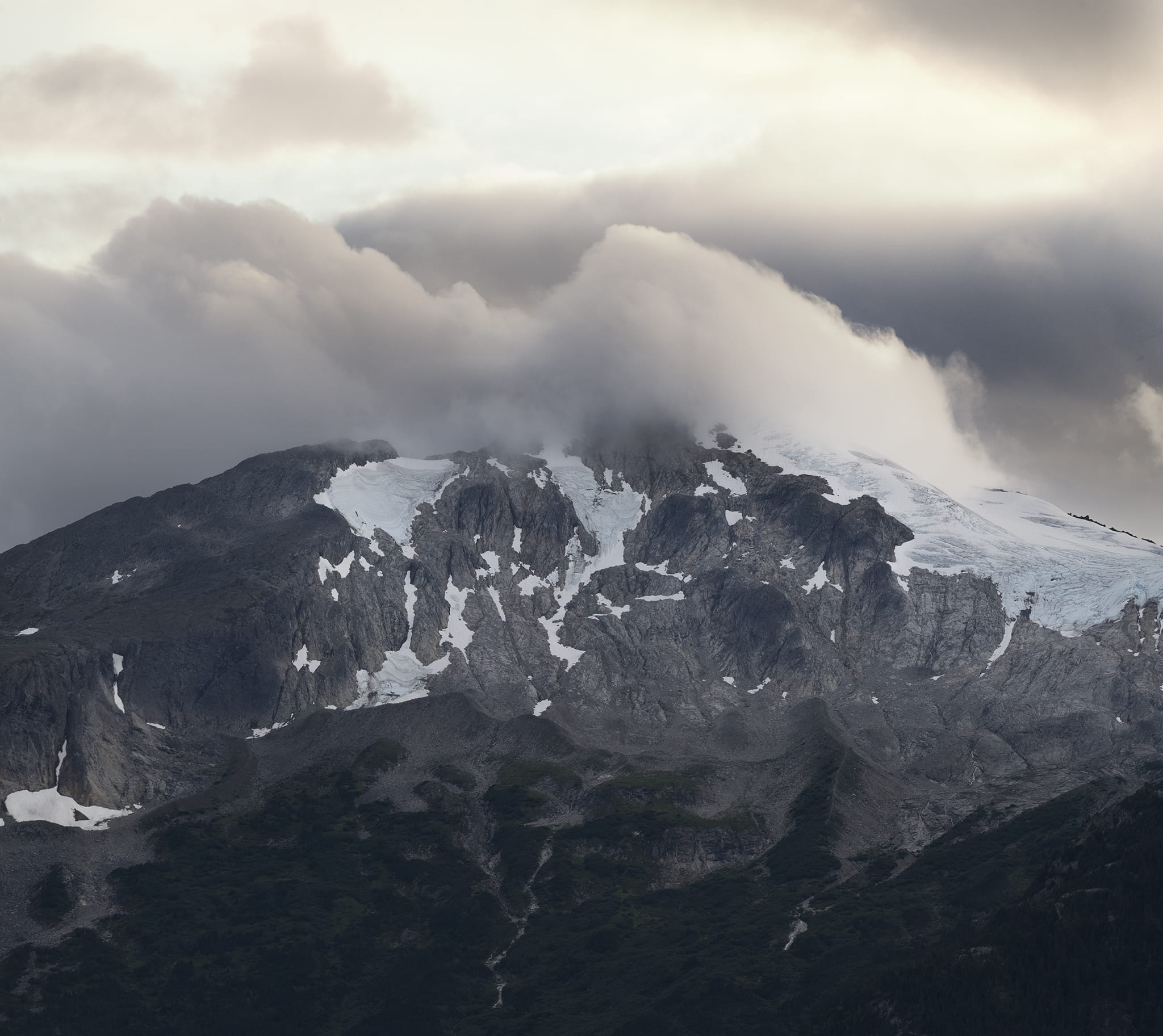 Alaskan mountain covered with clouds