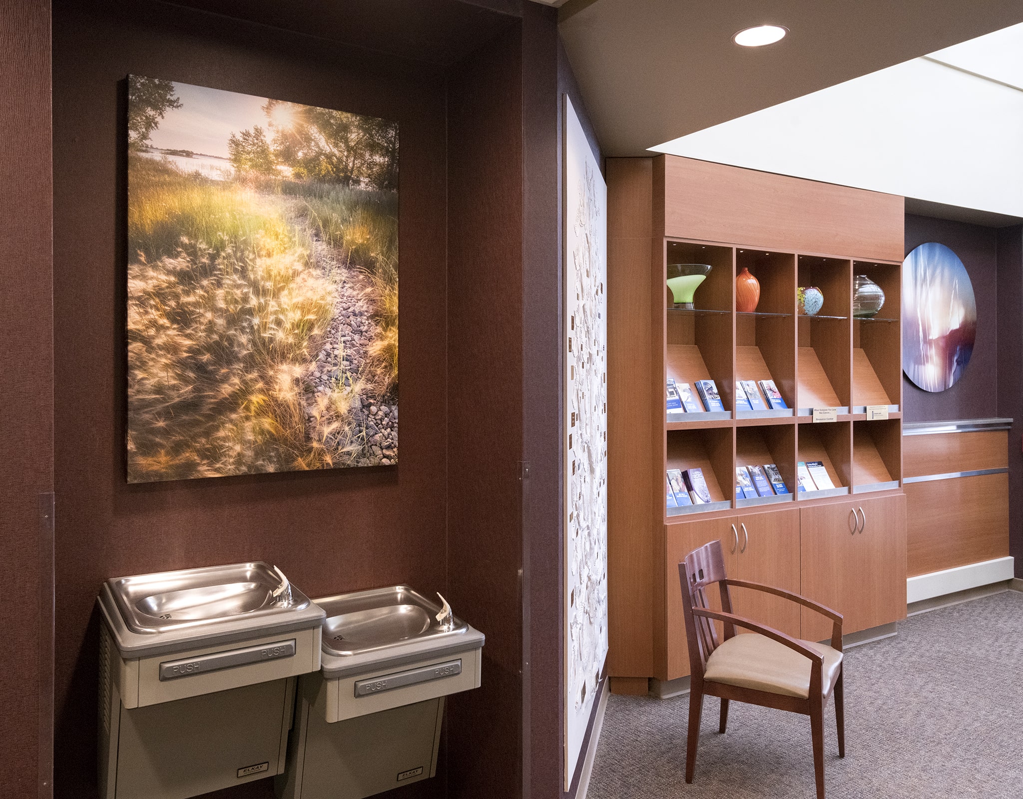 Artwork above drinking fountain in lobby