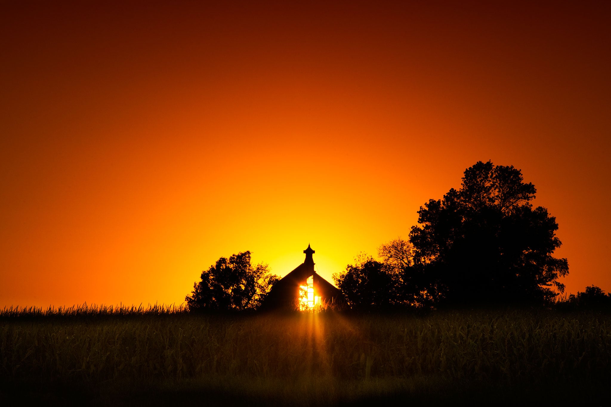 Sun Behind Barn