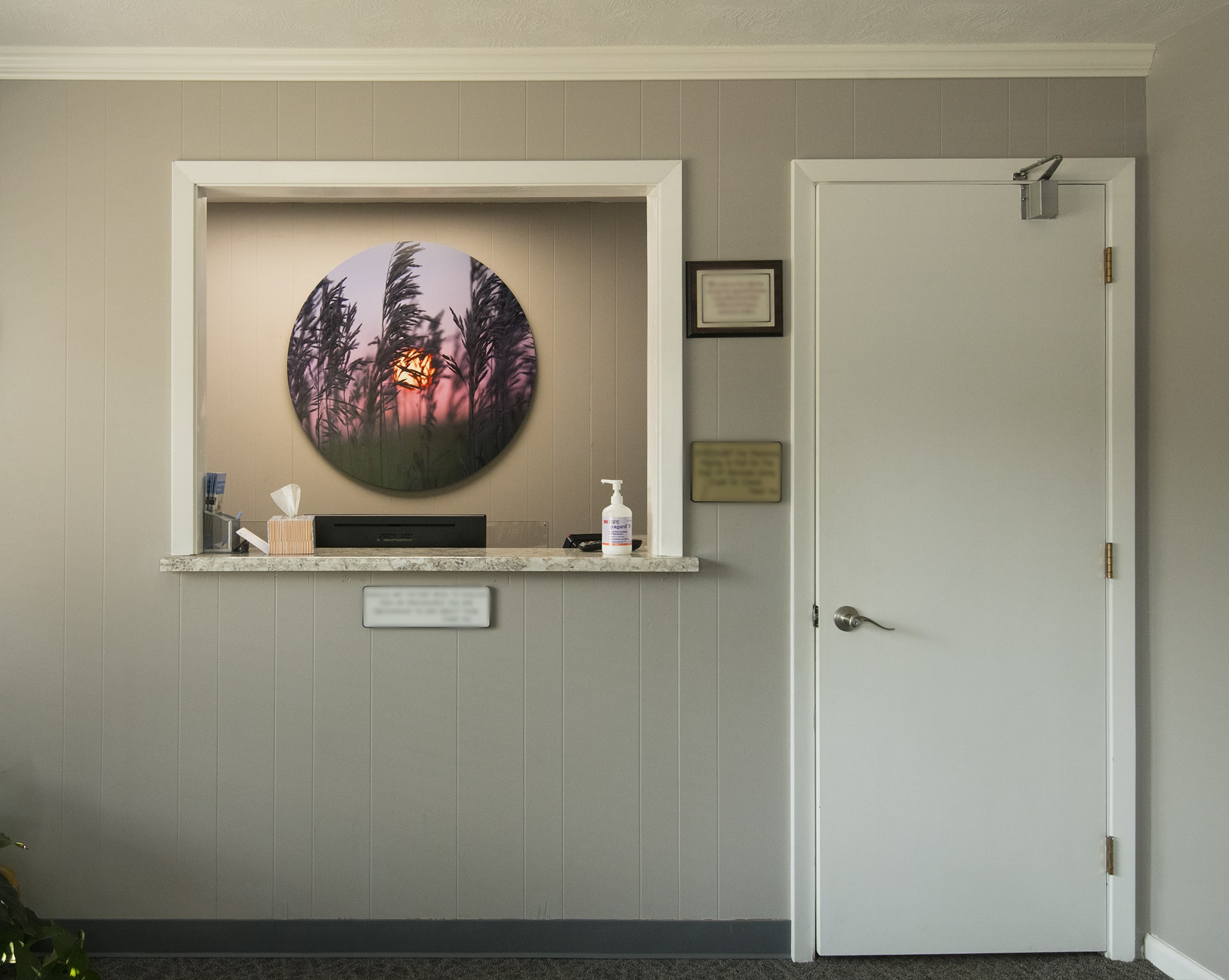 Round Metal Artwork in the Reception Room